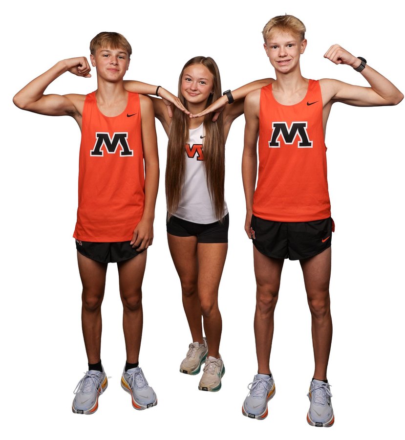 Three Moorhead runners flexing for the camera