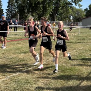 Three Spuds middle school boys running together
